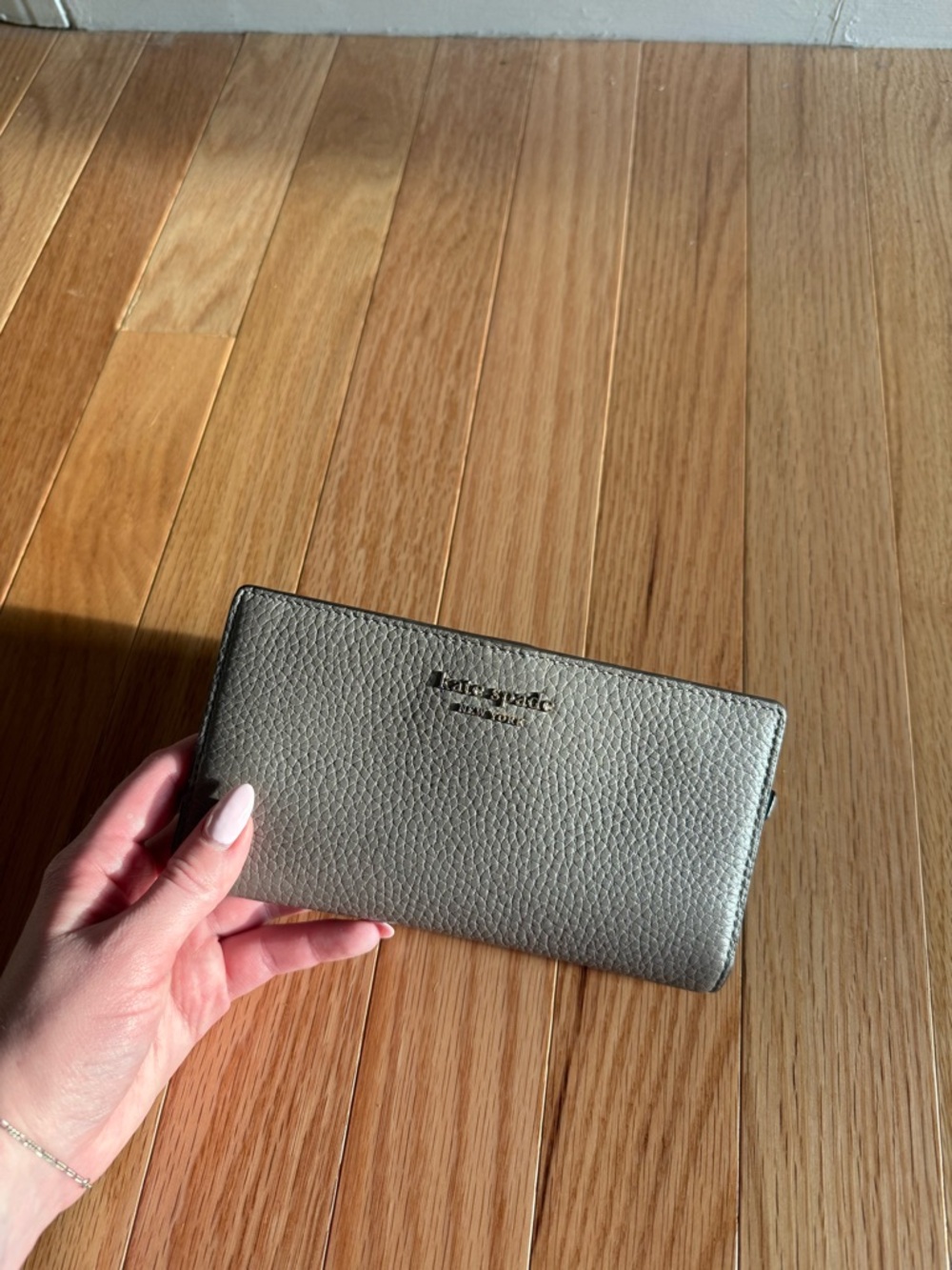kate spade metallic silver pebbled leather zip-around wallet